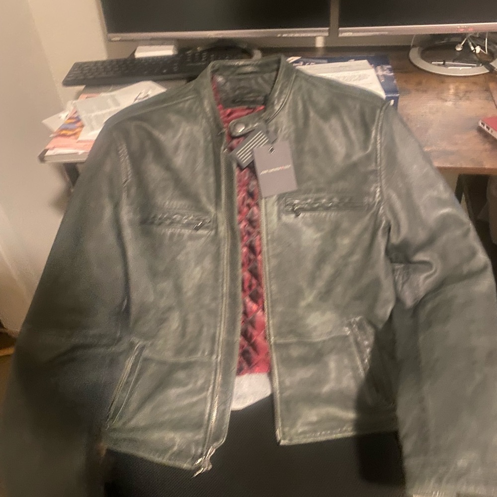 Never been worn Johnny Varvatos leather jacket that is retail $795. Does notfit